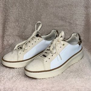 Cole Haan Grand pro Top Spin sneaker with leopard heel accent.